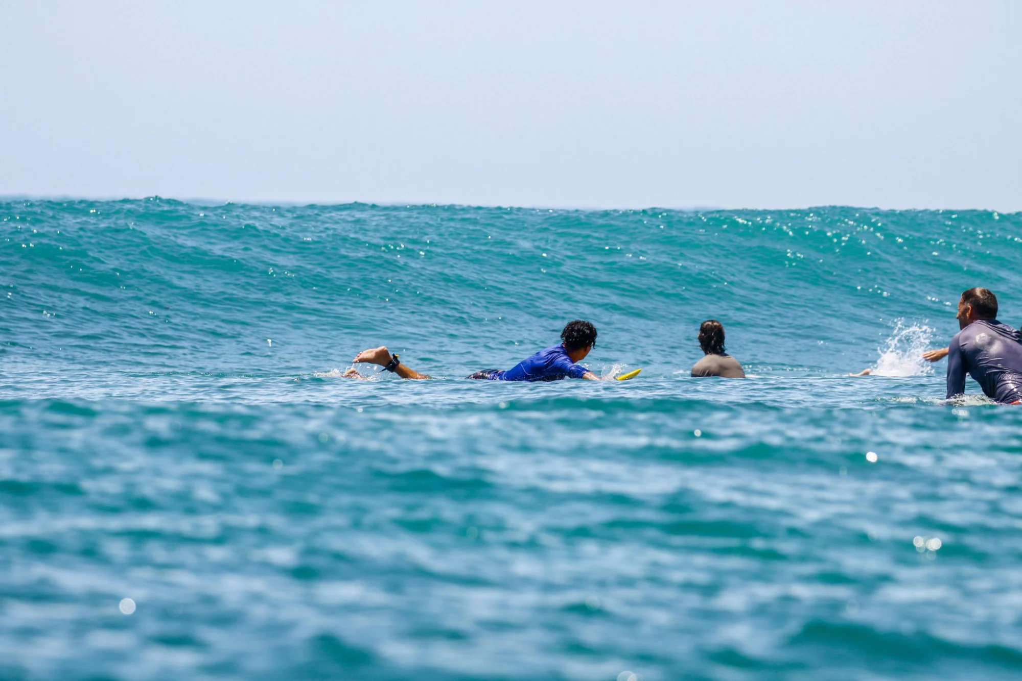 Guests paddling out together at Cabarete