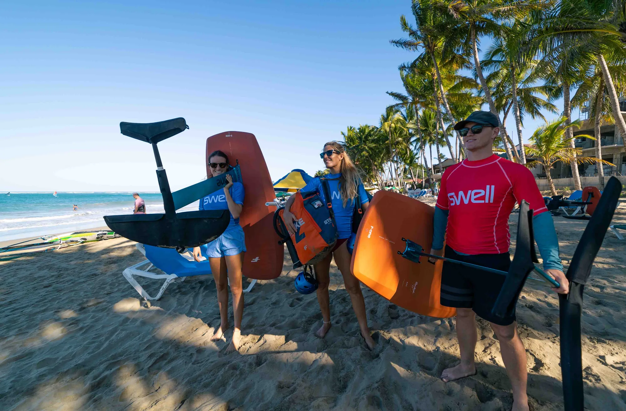 The Swell crew gathered on the beach